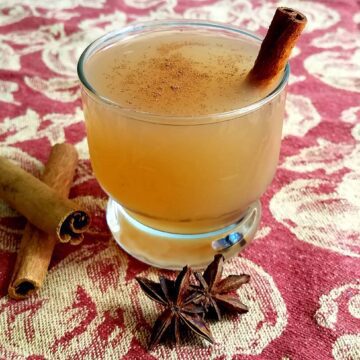 Delicious hot apple cider in a glass.