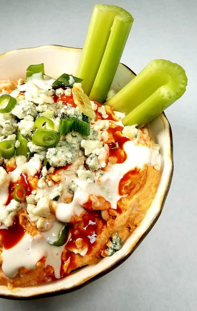 A close-up of crockpot Buffalo chicken dip.
