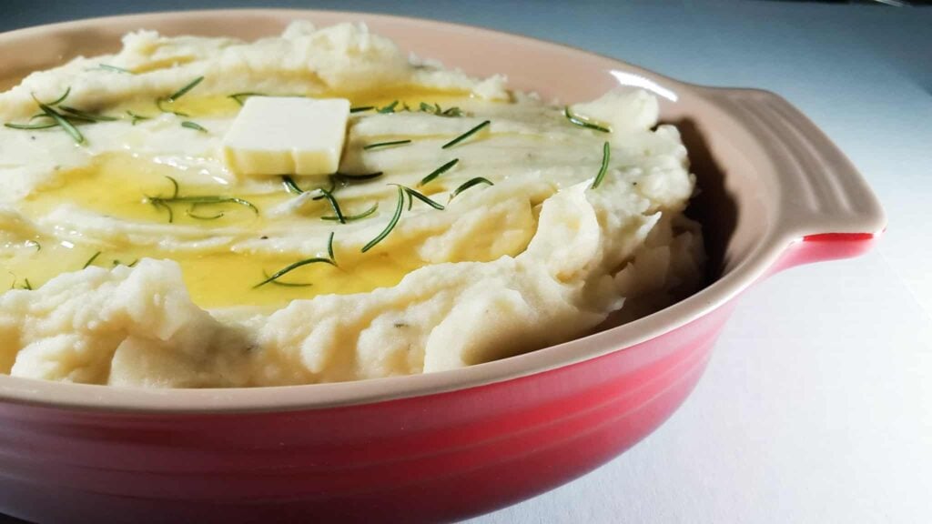 A casserole dish filled with Instant Pot Mashed Potatoes