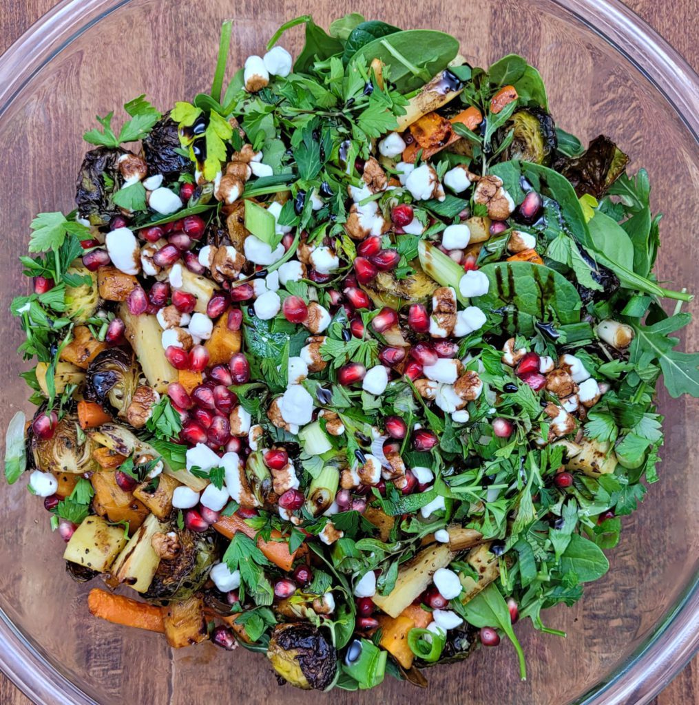 A large bowl of roasted vegetable salad.