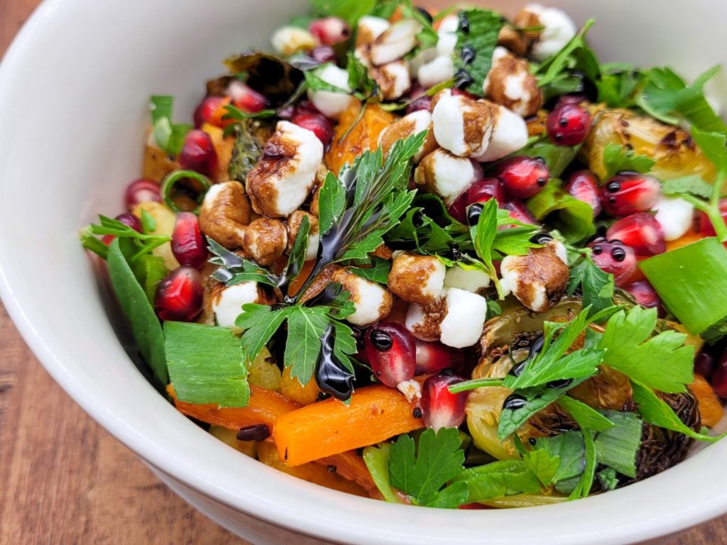 A bowl of oven roasted vegetable salad.