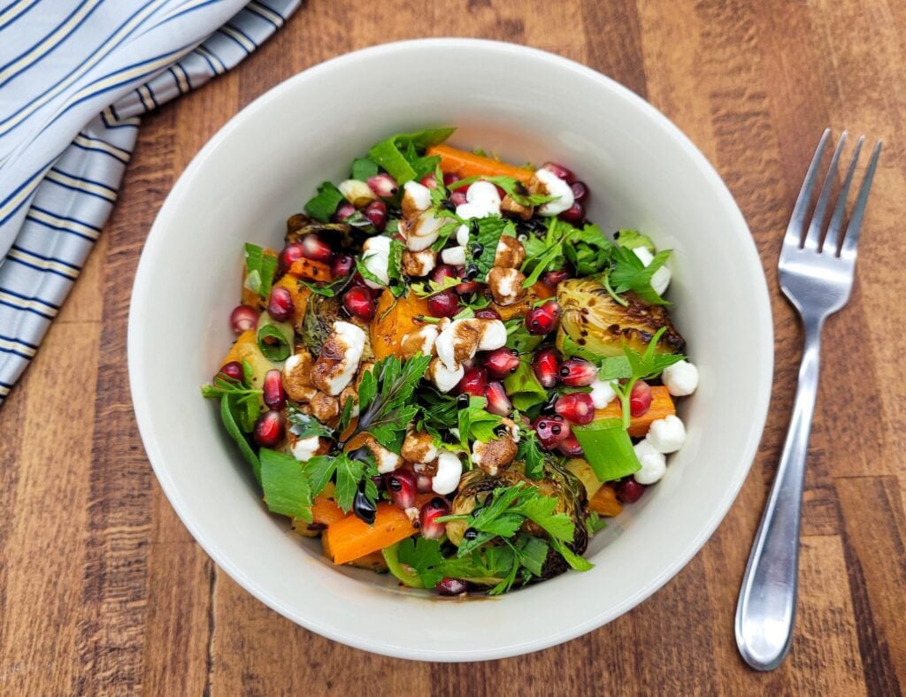 A bowl of colorful oven roasted vegetable salad.