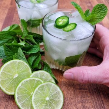 Holding a hot honey mojito mocktail.