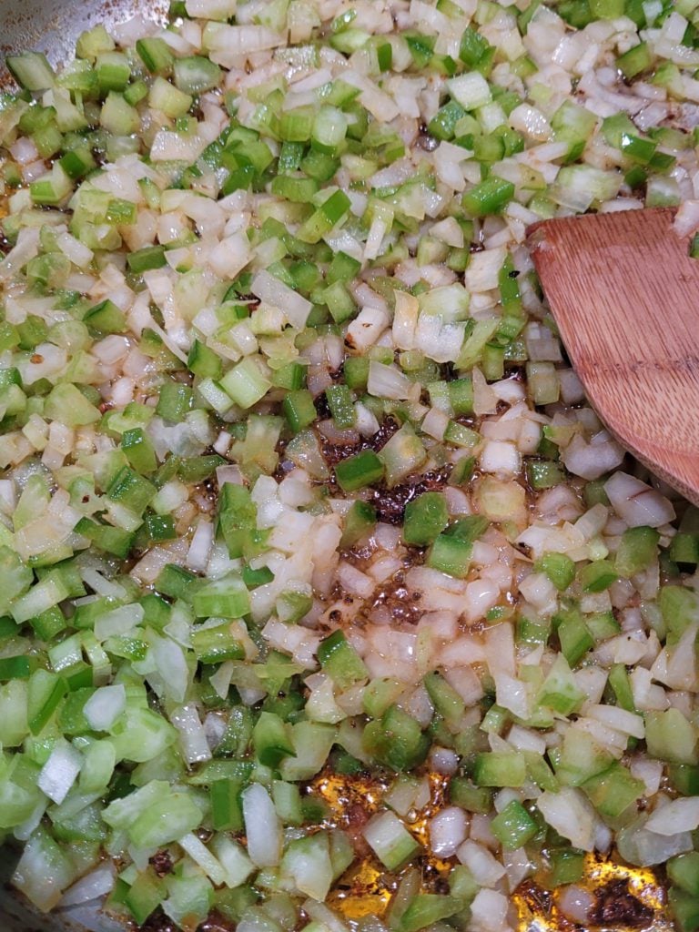 Sweating the Holy Trinity (celery, onion, green bell pepper) in skillet.