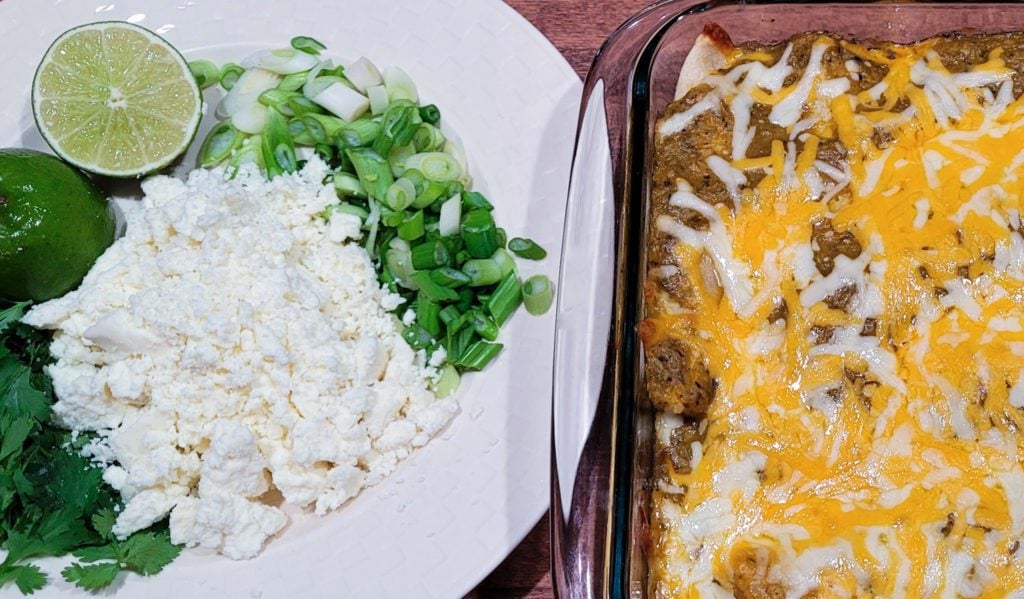 A plate of garnishes for chicken enchiladas.