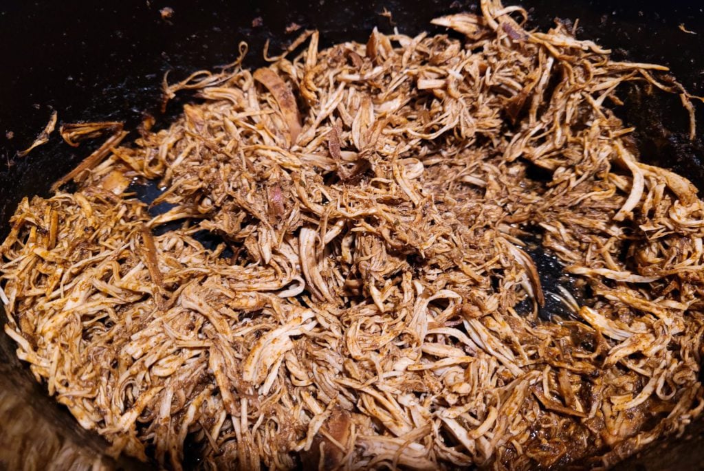 Shredded chicken for chicken enchiladas.
