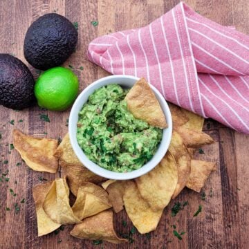 Above view of 4-ingredient guacamole in a white bowl
