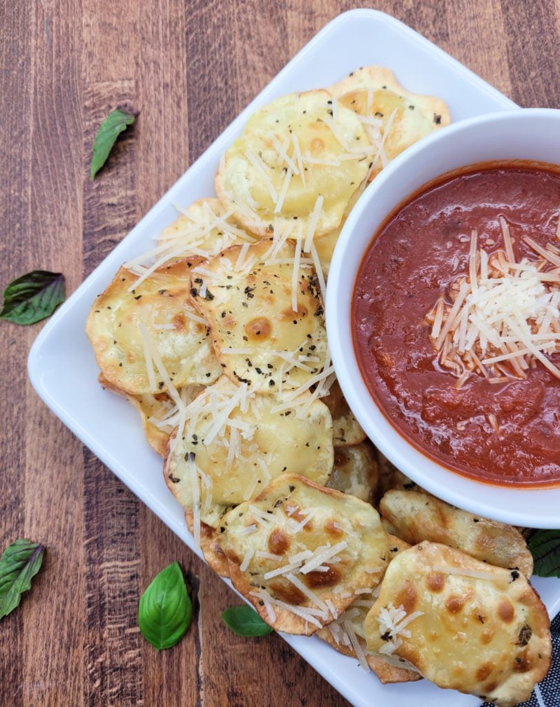 A plate of air fryer ravioli on a square plate