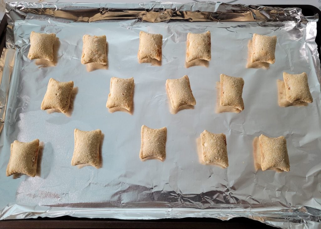 Frozen pizza rolls on sheet pan