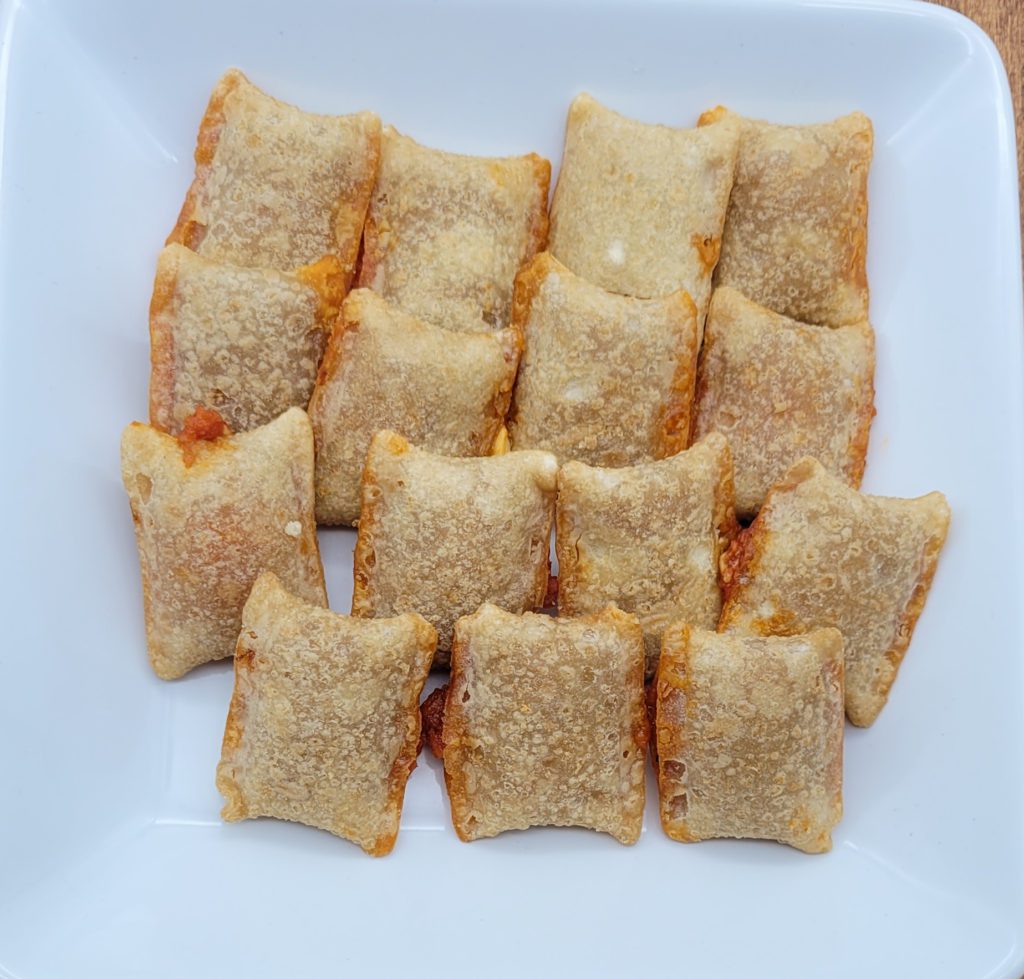 Plate of microwaved pizza rolls