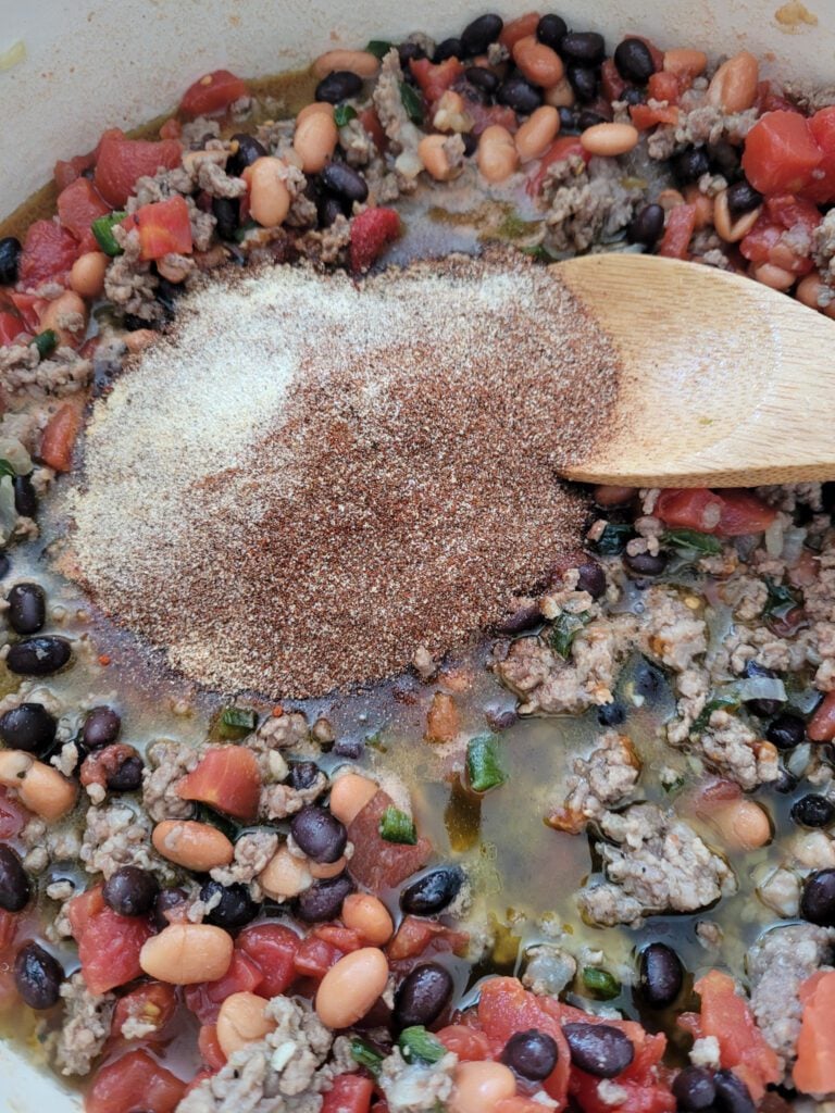 Adding chili spices to Dutch oven chili