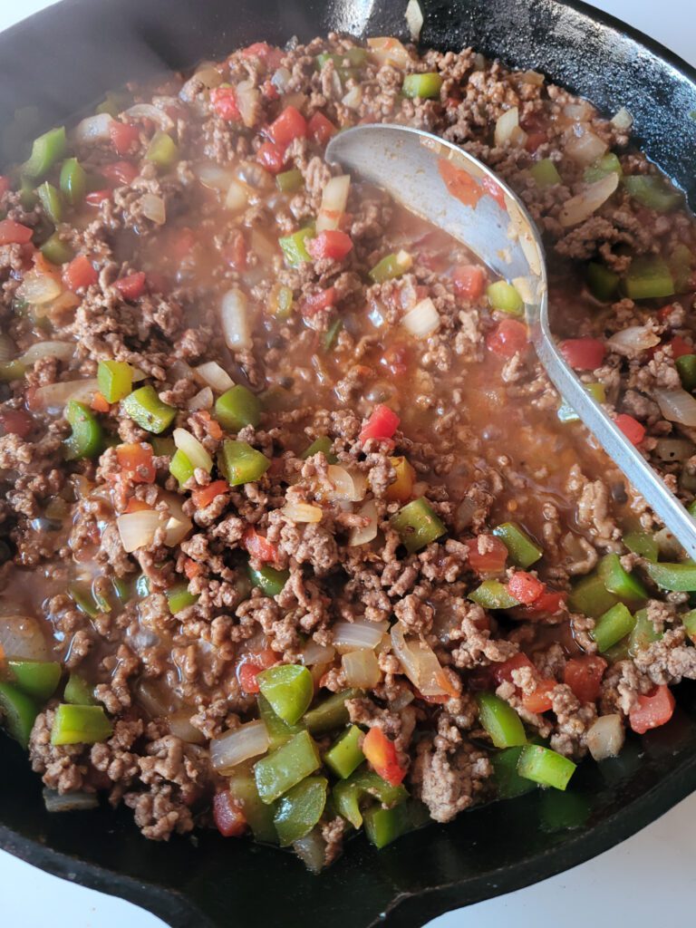 Texas Toast Sloppy Joes filling, cooking on the stove in a skillet