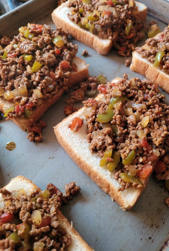 Texas Toast Sloppy Joes filled with filling on a sheet pan
