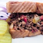 Texas Toast Sloppy Joe with a side of pickles and red onions