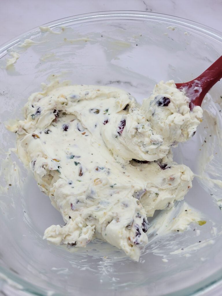 Mixing the ingredients for a Cranberry Pistachio Cheese Log