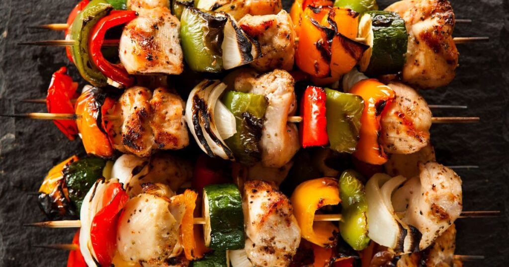 Three perfectly grilled chicken skewers