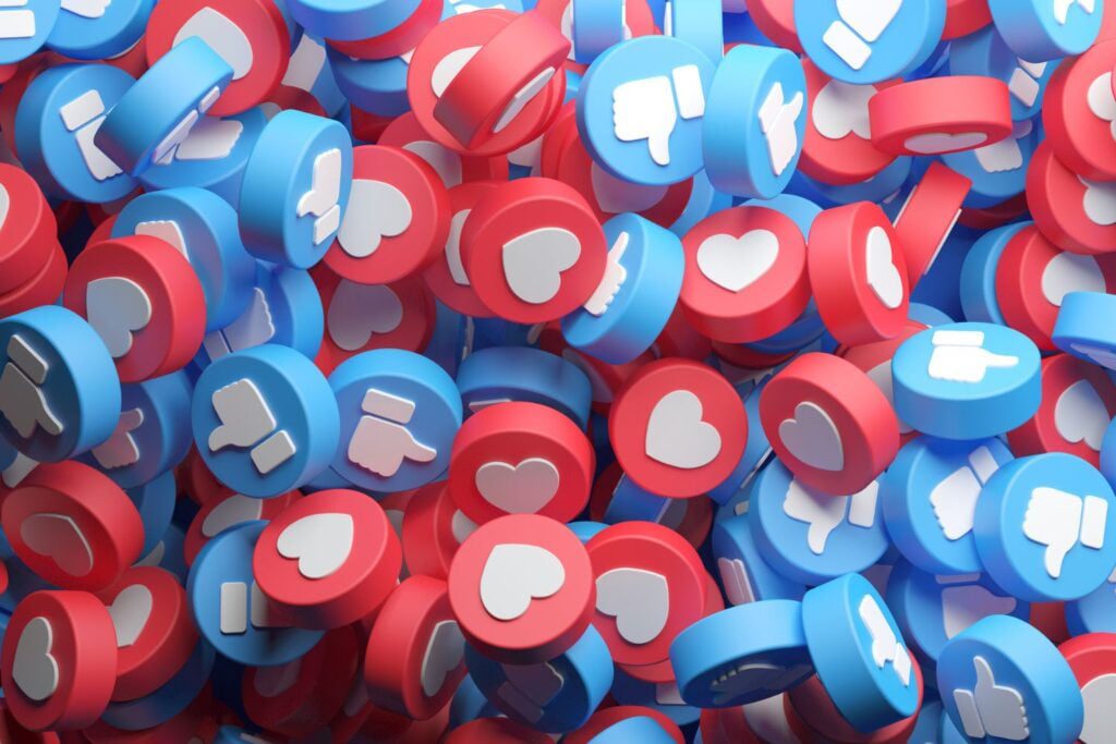 A pile of red and blue like and share buttons