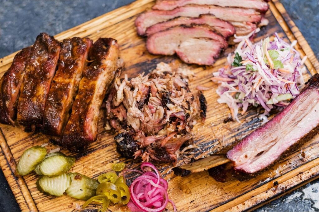 A variety of smoked meats on a board