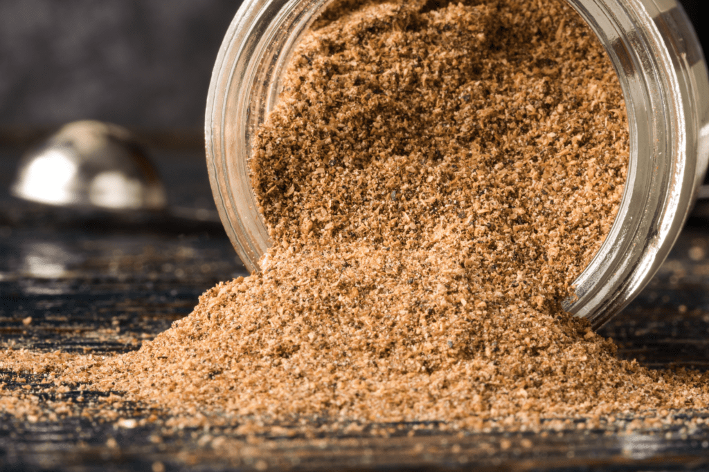 A spice blend spilling our of its bottle